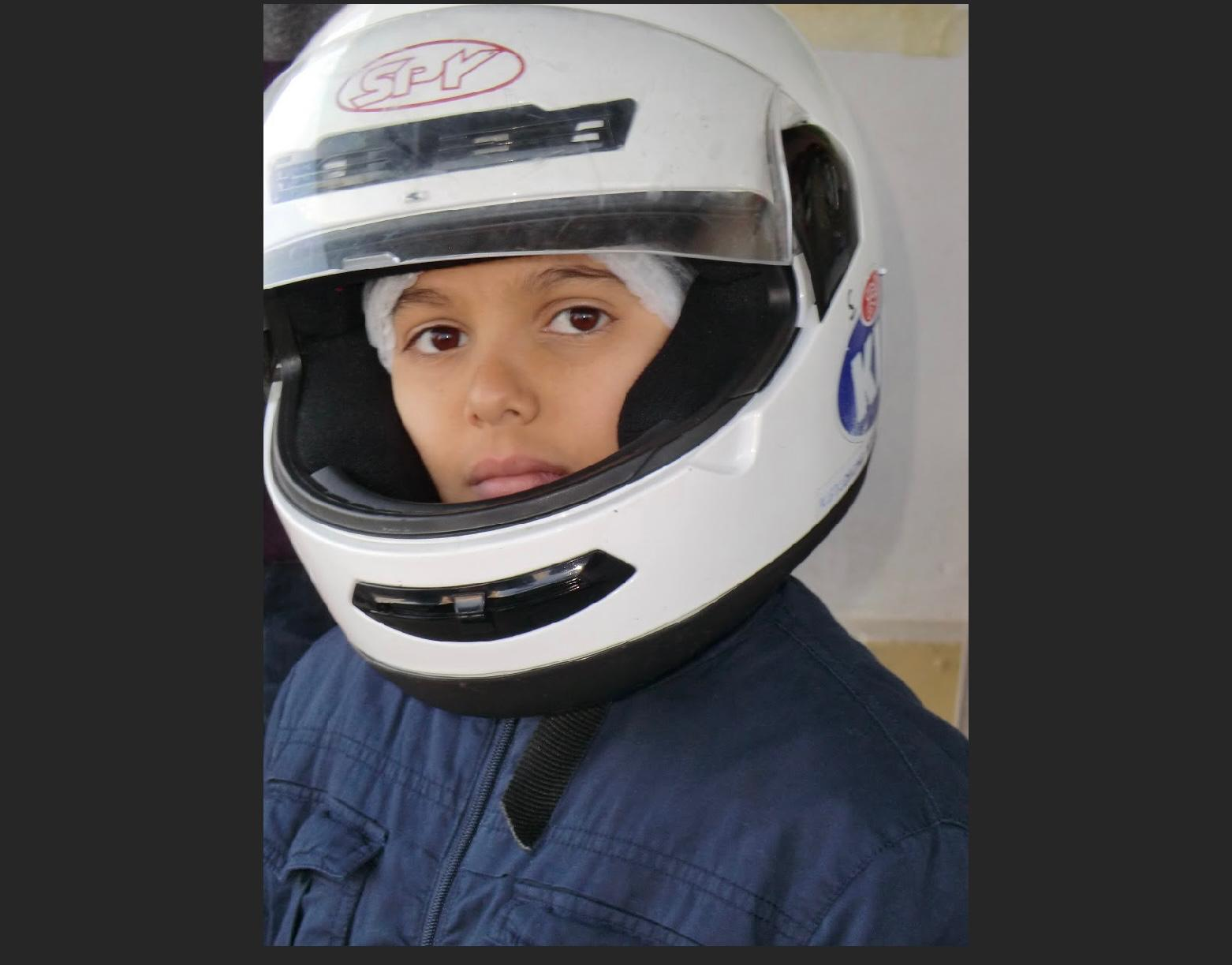 Diego Sirgado as a child wearing his first racing helmet